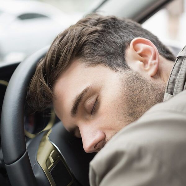 Driver Anti Sleep Alarm_0000_drunk-man-slumped-steering-wheel.jpg